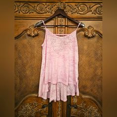 Free People Super Cute Strappy High Low Tank Top In Light Pink. This Semi Sheer Tank Has A Unique Strap Across The Back And A Ruffled Bottom Layer That Adds A Flirty Look To Your Workout Or Athleisure Time. Bundle And Save! Smoke Free, Hypoallergenic Dog Home Summer Tank Top For Layering, Summer Layering Tank Top, Summer Loungewear Camisole Tops, Summer Cami Top For Layering, Summer Layering Cami Top, Pink Relaxed Fit Tank Top For Spring, Relaxed Fit Pink Tank Top For Spring, Summer Tank Tops For Loungewear, Pink Relaxed Fit Tank Top For Summer