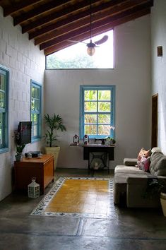 a living room filled with furniture and a flat screen tv