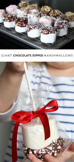 a person holding a tray with chocolate dipped marshmallows in it and another photo showing the same