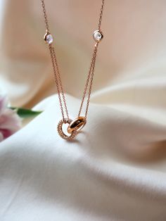 Unleash your bold and adventurous spirit with the MB Duo Necklace. Made with sterling silver plating in both rose gold and gold, this necklace symbolizes unity with its interwined rings. Take a risk and wear it as a reminder to always stay united and connected! Duo Necklace, Engagement Ring Necklace, Rose Gold And Gold, Take A Risk, Pearl Collection, Pendant Rings, Engagement Jewelry, Crystal Collection, Rose Gold Necklace