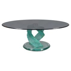 an oval glass table with wavy design on top