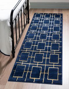 a bed with a blue rug on top of it