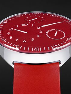 Ressence has a ""less is more"" philosophy but it can still make a statement, as this limited-edition 'Type 1 Slim' watch shows. Rendered almost entirely in red, it represents a departure from the house's signature colour palette, inspired by a one-of-a-kind timepiece created in 2020. Like other iterations of the model, this one has a titanium case and runs on an Orbital Convex System that's driven by the minute axle of an automatic movement to display the time and day in a unique way. The rubbe Classic Red Analog Watch, Luxury Red Analog Display Watch, Timeless Red Watch With Analog Display, Modern Red Chronograph Watch With Subdials, Luxury Red Chronograph Watch With Analog Display, Modern Red Watch Accessories With Subdials, Red Classic Analog Chronograph Watch, Classic Red Analog Chronograph Watch, Classic Red Chronograph Analog Watch