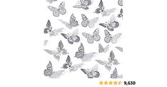 a group of butterflies flying through the air