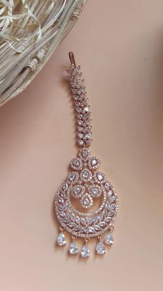 Bridal Cz Ad Diamond Maangtikka / Rose Gold AD Maangtikka / American Diamond stone maangtikka  / CZ tikka / Crystal Maangtikka These Celebrity Inspired Bridal Cz Ad Diamond Maangtikka are a Perfect Accessory This Wedding Season. Secured with a post and back Handcrafted To Perfection Perfect For Indian Weddings And Celebrations A Beautiful & Memorable Gift for Weddings and Special Occasions Fashion Empire Studio gives you new look, Made of high quality material(s).  This is very Designer Long Jhumki , Its A Choice Of Many Bollywood Celebrities.  Trust me, it is more Beautiful in Real another the Picture  This beautiful Set which is light in weight. The stones used are of high quality and the alloy used is led free. Designed By Master Craftsmen. Based On Indian beautiful Jewelry with a touch Traditional Hand Set Cubic Zirconia Tikka, Bollywood Style Hand Set Tikka For Eid, Bollywood Style Hand-set Tikka For Diwali, Hand Set Bollywood Tikka For Diwali, Bollywood Style Hand Set Tikka For Diwali, Bollywood Style Tikka For Diwali With Hand Set, Round Bollywood Tikka With Stone Work, Hand Set Round Tikka For Diwali, Bollywood Style Round Tikka With Stone Work