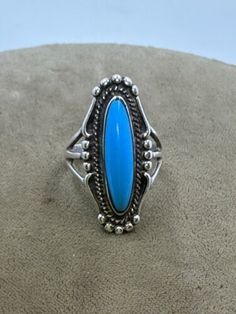 Vintage Ted OTT Native American Sterling Silver Turquoise Ring size 6. Top measures 30mm x 13mm. Stone is 21mm x 5mm. Weighs 6.3g Collectible Round Turquoise Ring, Classic Turquoise Rings Collectible, Classic Turquoise Ring For Collectors, Southwestern Style Blue Nickel-free Rings, Adjustable Blue Turquoise Ring Collectible, Classic Turquoise Oval Cabochon Jewelry, Classic Blue Turquoise Sterling Silver Ring, Vintage Blue Cabochon Turquoise Ring, Vintage Blue Turquoise Cabochon Ring