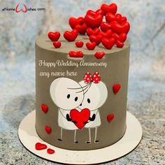 a wedding cake with hearts on it and the words happy wedding anniversary any name here