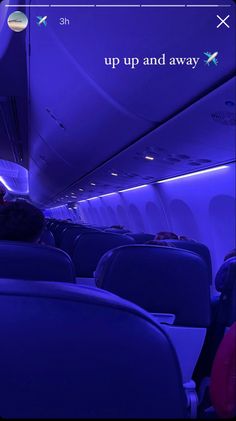 the inside of an airplane with blue lighting