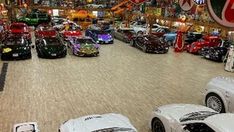 a room filled with lots of different types of cars