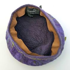 Have you ever eaten a fresh purple fig? This playful Purple and Green Fig Hat will help remind you of travels in Italy - whether real or imagined. And instead of eating the fruit, you can BE the Fruit - a Fig. This particular felted hat is on the medium-large side. If you need another size, please see here for other Fruit Hats. COLOR: • The color of this felted hat is deep purple with lighter violet and green shading. The stem of the hat is an olive green SHAPE: • The hat has a fig-like shape wi Felted Hat, Green Fig, Small Towel, Hand Felted, Chilly Weather, The Fruit, Wet Felting, Deep Purple, Fig