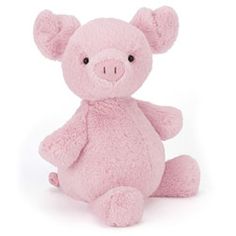 a pink teddy bear sitting up against a white background