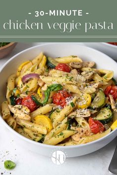 a white bowl filled with pasta covered in chicken and veggies next to a fork