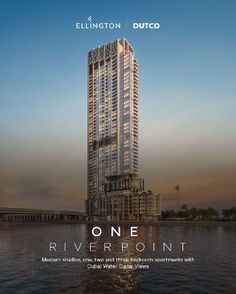 a tall building sitting on top of a body of water