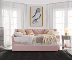 a bedroom with white walls and pink furniture