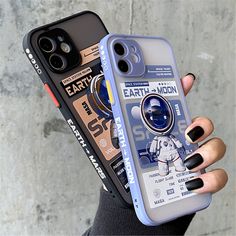 a woman holding up a phone case with an astronaut design on the front and back