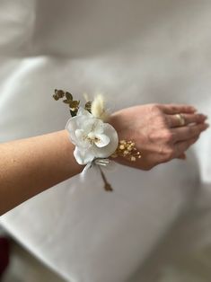 a close up of a person's arm with flowers on it