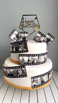 a birthday cake decorated with film strips and photos