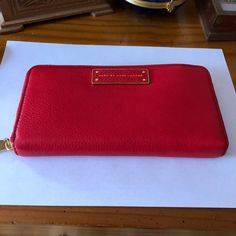 100% Cow Leather, Imported, Polyester Lining, Four Card Slots, One Slip Pocket. Brand New With Tags. This Is A Vibrant And Rich Red Wallet! So Soft And Beautiful That It Can Also Be Used As A Clutch, If You Want To Show It Off! It Can Hold Everything You Would Want To Put In A Wallet Even A Phone. It Features The Logo Plaque At Front, Polished Brass Tone Hardware. Lined With Red Logo-Jacquard Fabric; Three-Compartment Gusseted Interior Features Two Bill Pockets, Twelve Card Slots, One Slip Pocke Designer Red Wallet For Daily Use, Red Designer Wallets For Daily Use, Designer Red Wallet For Travel, Bags Marc Jacobs, Too Hot To Handle, Red Wallet, Marc Jacobs Bag, Red Logo, Jacquard Fabric