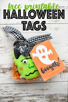 a halloween treat in a bag with the words free printable halloween tags on it