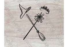 a drawing of two brooms and a hat on top of a piece of wood