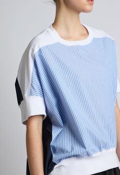 One size, fits XS-LColor: BlueWhite and Light Blue Striped FrontNavy Blue BackWhite Contrast PanelsLonger in back80% Cotton 20% NylonDry Clean or Hand Wash By The NKC StoreProduct Measurements:Bust: 147.32cm / 58inLength: 53.34cm / 21inSleeve Length: 22.86cm / 9inModel is 175cm / 5'9" wearing Size O/S Printed Women Shirts, Black Tank Dress, Blue Back, Boyfriend Tee, Knit Tank, Engineered Garments, Tie Top, Knitting Women, Knitted Tank Top