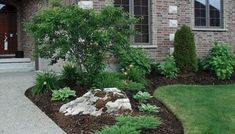 a house with landscaping in front of it