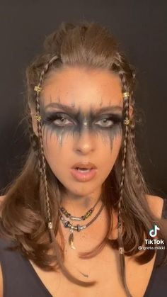 Brown hair unique braid accents with face mascara attraction. Music festival wear Women Vikings Costume, Viking Fairy Makeup, Viking Women Makeup Faces, Black Viking Makeup, Viking Make Up Woman Halloween, Diy Viking Makeup, Vikings Women Costume, Viking Seer Makeup, Viking Look Woman