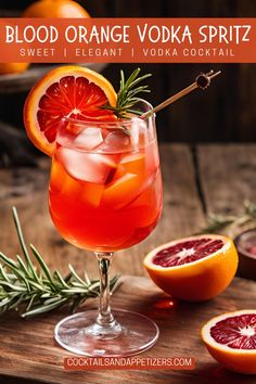 blood orange vodka spritz in a glass with grape and rosemary garnish