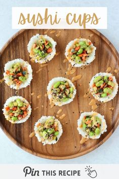 sushi cups on a wooden platter with text overlay that reads pin this recipe