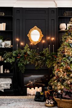 a decorated christmas tree in front of a fireplace with candles and wreaths on the mantle