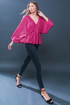 This START OF FOREVER sequin top is a stylish and flattering choice for any occasion. It features a V neckline, kimono sleeves, and a peplum cut for a unique, on-trend look. With its shimmering sequin design, it's sure to make a statement. DetailsSelf : 100% PolyesterLining : 100% Polyester Size & Fit- Model is 5`8" And Wearing Size Small- Measurements Taken From Size Small- Approx. Length: 23" Fitted Long Sleeve Peplum Top For Party, Glamorous Pink V-neck Blouse, Glamorous V-neck Cocktail Tops, Glamorous V-neck Holiday Tops, Pink V-neck Top With Sequins, Chic V-neck Peplum Top For Party, Festive Sequined V-neck Top, Chic V-neck Holiday Tops, Holiday Evening V-neck Top