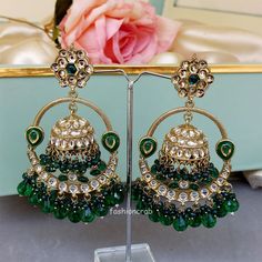 A pair of golden-toned Vaani Jhumka Earrings – Green Earrings for Girls with hanging pearls. Size & Other Details Length :  11.5cm Weight : 34gm/pc Material  : Alloy, Pearl, Kundan, Stone work Shape : Dome Shaped Attire :  Lehenga Choli, Salwar Suit, Kurti, Saree, Flared Dress Green Pearl Earrings For Festivals, Pearl Jhumkas, Green Pearl Earrings, Suit Kurti, Celebrity Jewelry, Chandbali Earrings, Earrings For Girls, Bollywood Style, Bollywood Jewelry