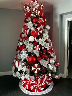 a christmas tree decorated with red and white ornaments