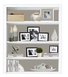 a white book shelf filled with pictures and other items