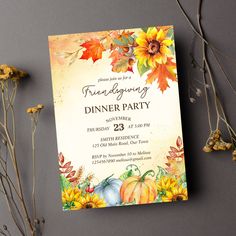 a thanksgiving dinner party with sunflowers and pumpkins