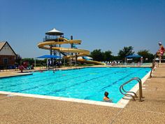 an empty swimming pool with people in it