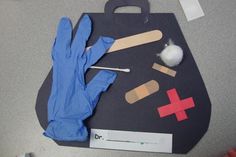 gloves and other medical supplies are laid out on a table