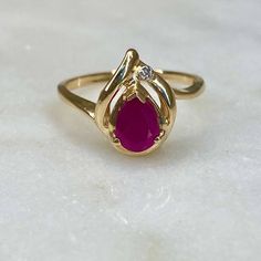 14k Yellow Gold Real Ruby gemstone Small diamond 2.6gm Size 6.5 resize available under request Thank you for visiting our shop! Please check us our Etsy Shop https://www.etsy.com/shop/DMKjewelryCo?ref=simple-shop-header-name&listing_id=1101981722 Visit our website DmKJewelry.com Also Follow us on Instagram https://www.instagram.com/dmkjewelry_/ Teardrop Ruby Ring In Fine Jewelry Style, Teardrop Ruby Ring With Diamond In Fine Jewelry Style, Fine Jewelry Teardrop Ruby Ring With Diamond, Classic Teardrop Ruby Ring, Yellow Gold Teardrop Ruby Ring For Anniversary, Ruby Ring Vintage, Ruby Ring Gold, Ruby Diamond Rings, Vintage Diamond Rings