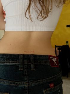 the back of a woman's stomach with her name written on it