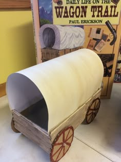 an old fashioned wagon made out of cardboard