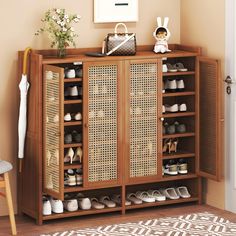 a wooden cabinet with baskets and shoes on it