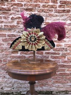 Historical tricorn hat with plumes, richly decorated. Complete your dress with this wool hat, created in our Atelier in Venice. Our tricorn-hat are made of wool and metal and are suitable for any size. They match perfectly with wigs. However you can wear them also without wig. All our hats are hand made and hand-decorated in our Atelier. This hat has been decorated with feathers, Swarovski crystals, trimming, lace. Size: please, choose the measure of the circumference of your head. Also, at the Traditional Costume Hats And Headpieces For Carnival, Victorian Curved Brim Costume Hat, Curved Brim Costume Hat For Carnival, Elegant Costume Hats With Pinched Crown, Elegant Costume Hat With Pinched Crown, Curved Brim Carnival Costume Hat, Curved Brim Hats For Carnival Costume, Elegant Costume Hats And Headpieces With Pinched Crown, High Crown Hats For Carnival Costume