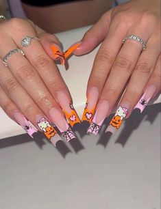 Holloween Nails Hello Kitty, Halloween Nail Designs Hello Kitty, Halloween Nails Pink And Orange, Fall Nails Hello Kitty, Pink Fall Acrylic Nails, Fall Hello Kitty Nails, Hello Kitty Spooky Nails, Fall Nail Sets Acrylic, Hello Kitty Nails Halloween