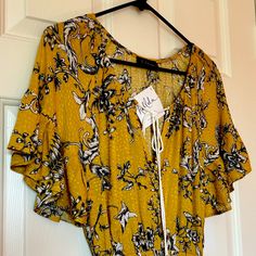 Never Worn, Still With Tags. Adorable Hallelu Boho Style Shirt-Sleeve Dress. Yellow With Flower Print And Scoop Neckline With Drawstring. Drop Waist Through Bottom Is Elastic Making It Form Fitting On Bottom. Size Small - Fits Like Xs. 100% Rayon Length From Neckline To Bottom (Front) 26”0 Armpit To Armpit 16.5” Mustard Short Sleeve Maxi Dress For Spring, Casual Mustard Maxi Dress With Floral Print, Yellow Short Sleeve Maxi Dress For Brunch, Yellow Printed Maxi Dress For Day Out, Yellow Rayon Dress For Day Out, Yellow Printed Mini Dress For Brunch, Summer Yellow Rayon Maxi Dress, Yellow Rayon Dress For Summer, Fitted Yellow Rayon Dress