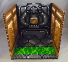 an open door made out of legos on a white tableclothed surface with green and orange designs