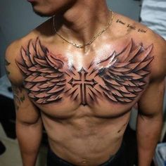 a man with tattoos on his chest and wings