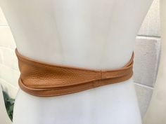 Camel brown OBI BELT in genuine leather. Wrap belt in tan color . Waist belt in soft natural leather. Tobacco brown leather belt. Saddle brown sash. Wraparound brown belt. The belt is 220 cm (86 inch) long and 8,3 cm (3 1/4 inch) at its widest (front) it gets smaller towards the end up to 1 cm (1/2 inch). 220 cm (86 inch) long and 8 cm (3 inch) at its widest (front) it gets smaller towards the end up to 1 cm (0,4 inch). https://www.etsy.com/listing/190889352/black-suede-obi-belt-in-natural-soft? Adjustable Brown Belt With Self Belt Detail, Adjustable Brown Belt, Brown Waist Belt, Leather Wrap Belt, Small Coin Purse, Beautiful Belts, Wrap Belt, Obi Belt, Saddle Brown