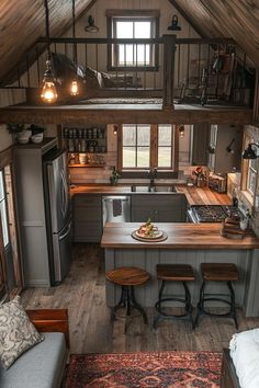 a kitchen with an island and stools in it