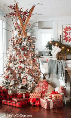 a decorated christmas tree with presents under it