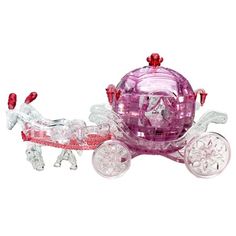 a pink glass horse drawn carriage with red and white decorations